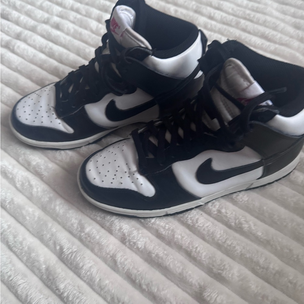 Nike Black and White Mid-Top Sneakers with Signature Swoosh